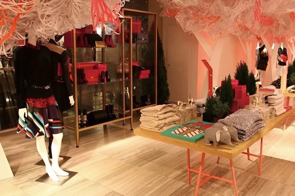 Holiday retail display with warm, peach-toned painted walls by a painter in Oahu, HI