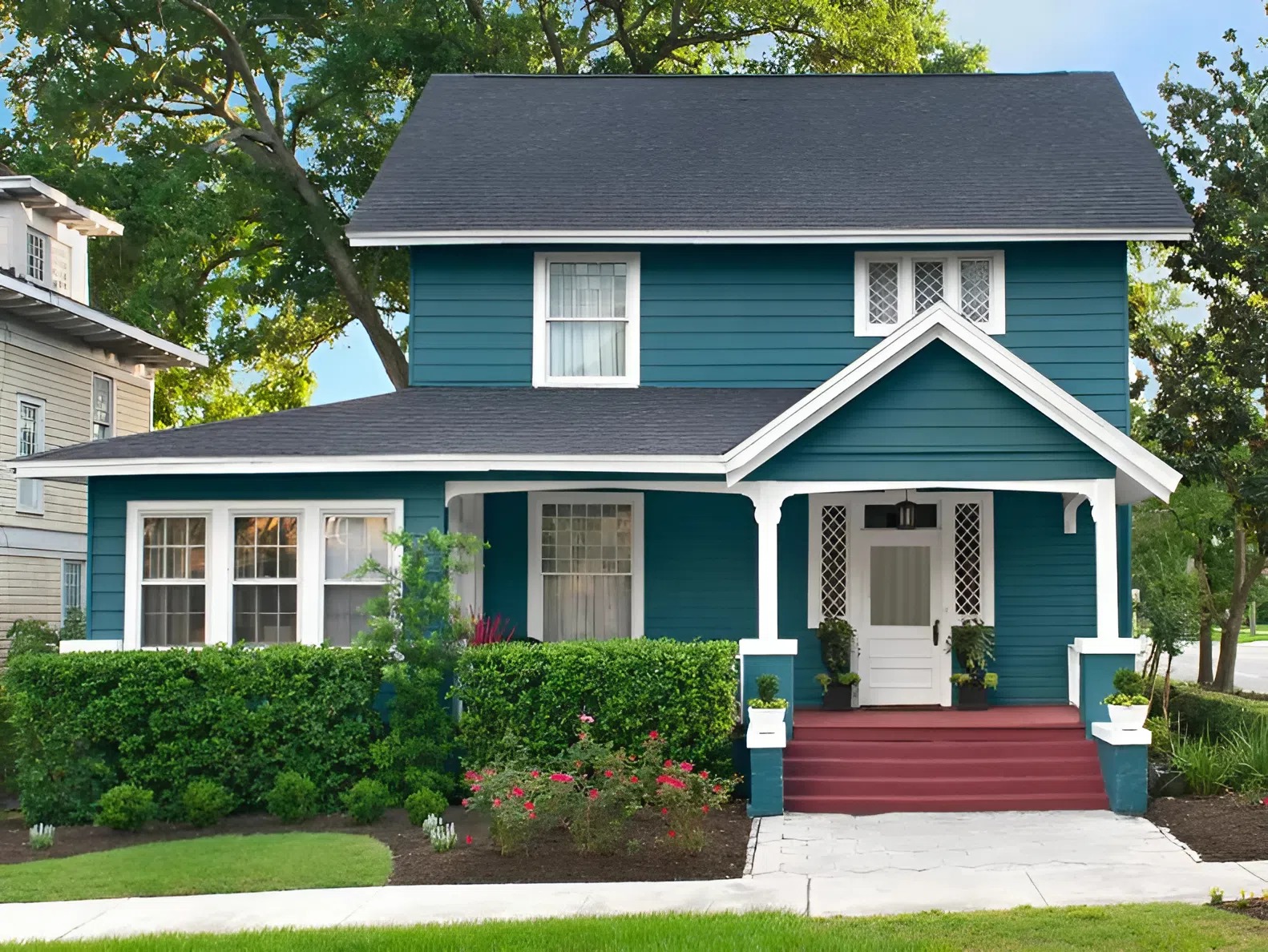Freshly painted teal home exterior with crisp white trim by a professional painter in Ewa Beach, HI