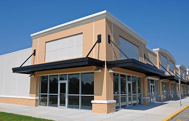 Commercial storefront featuring modern beige, cream, and black exterior paint colors by a professional painter in Mililani, HI