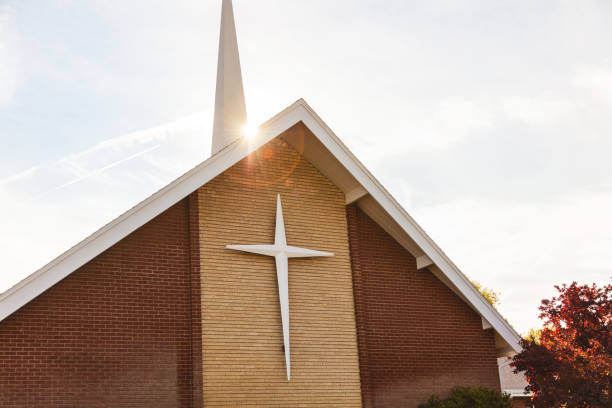 Brick church exterior with steeple and freshly maintained siding by a painting company in Kaneohe, HI