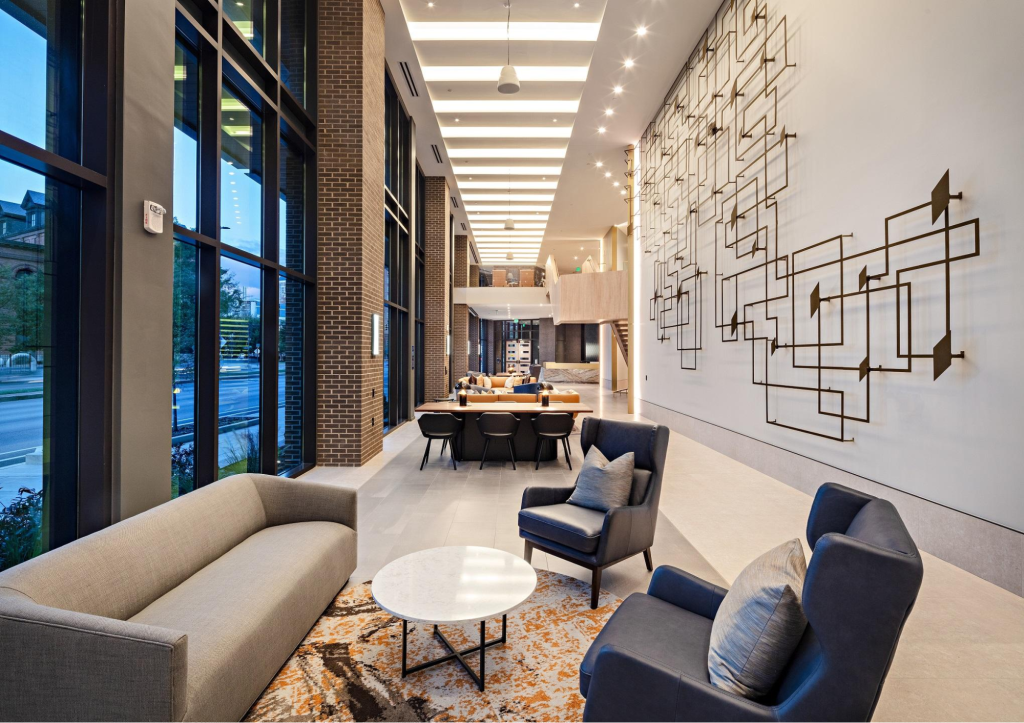 Apartment lobby with smooth matte white walls and contemporary commercial finishes by a painting company in Oahu, HI