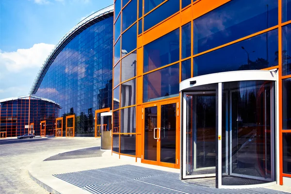 Commercial building with bold orange exterior finishes and contrasting trim by an exterior painter in Kapolei, HI.